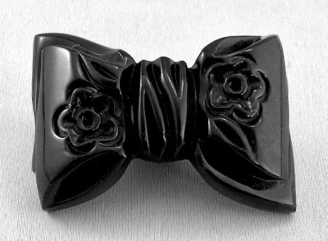 BP201 carved black bakelite bow pin